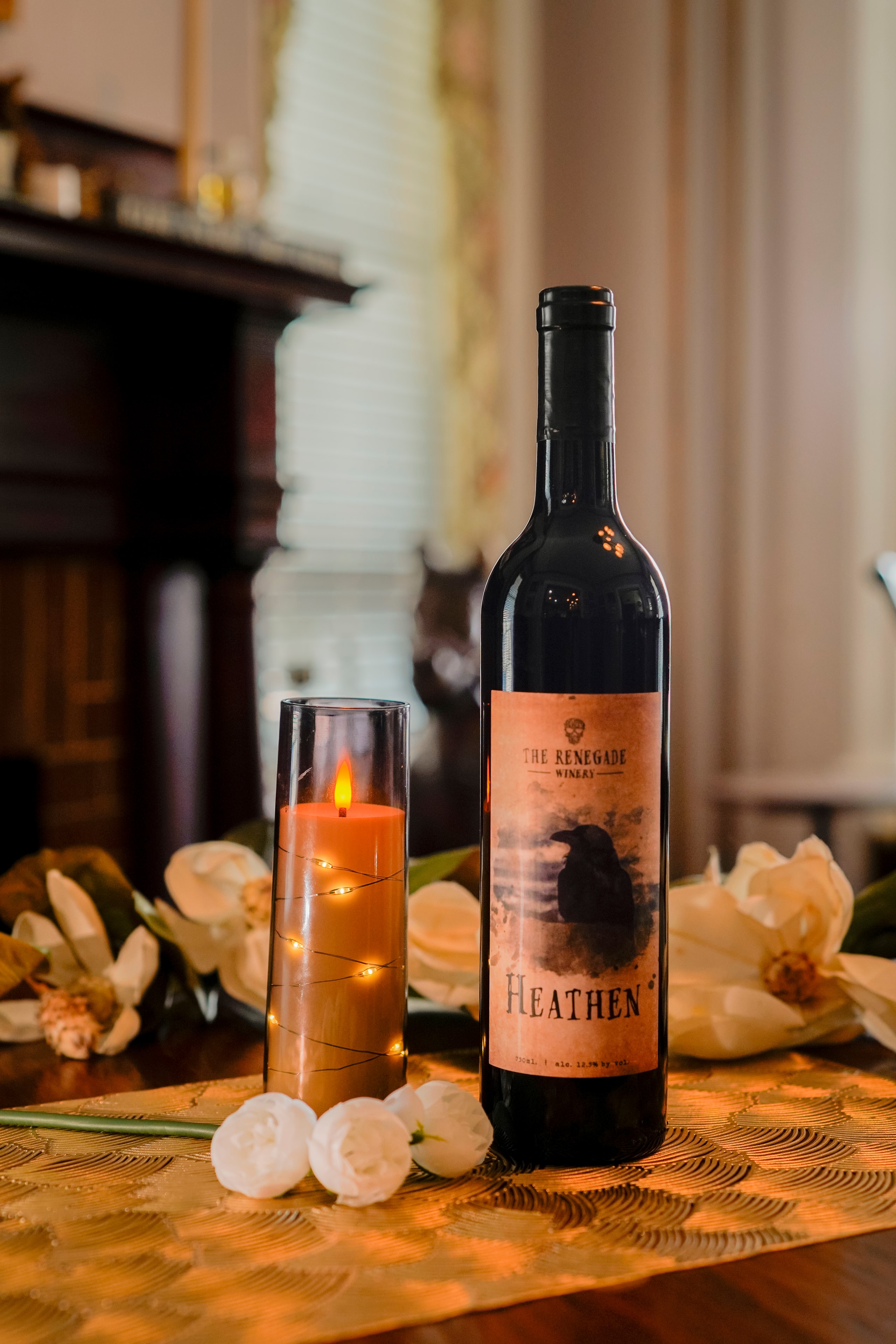 Renegade Winery Heathen red wine bottle candlelit evening styling